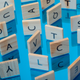 scrabble tiles with letters oriented different ways